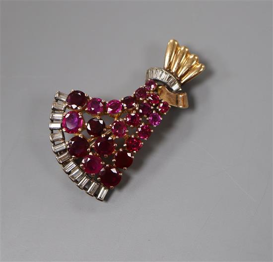 A 1950s yellow metal,ruby and diamond set fan shaped brooch, 44cm.